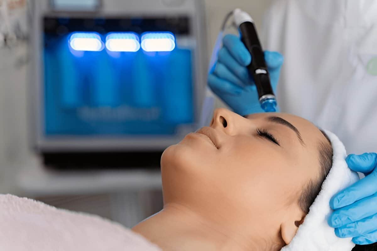 A woman receiving a non-invasive facial treatment at Sasha Aesthetic Clinic in Dubai.