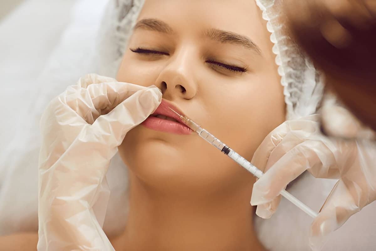 Woman receiving dermal filler injection for facial rejuvenation at Sasha Aesthetic Clinic.