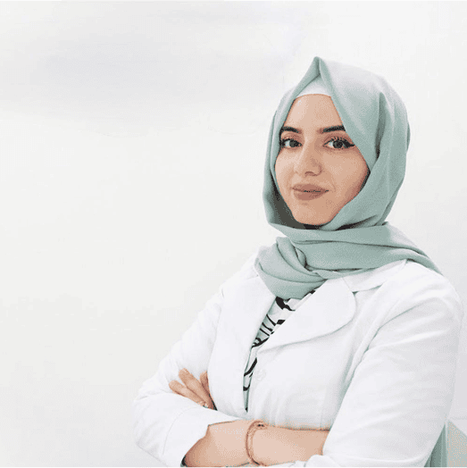 Professional female aesthetic specialist in hijab at Sasha Clinic.