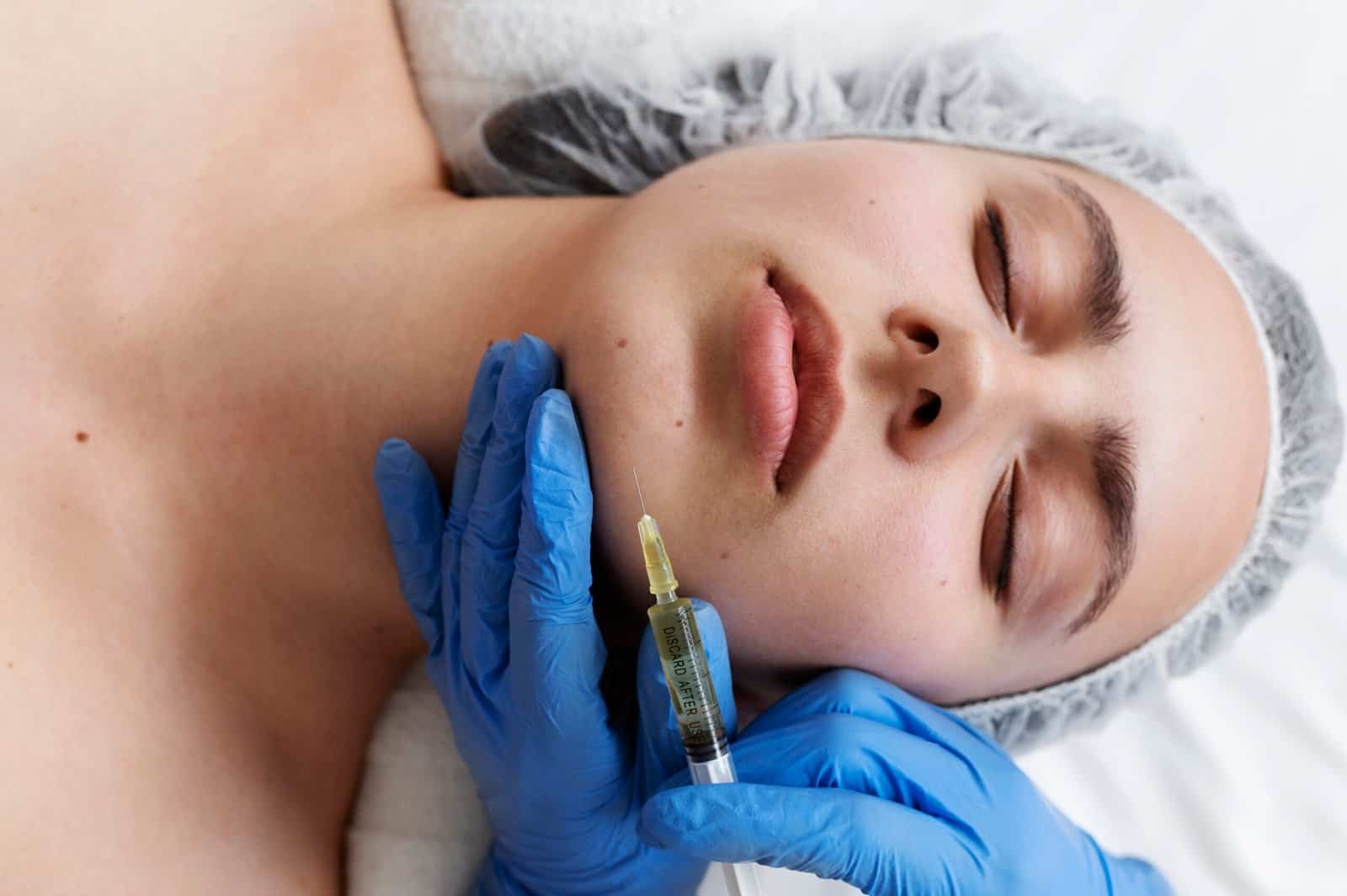 Patient receiving a facial regenerative injectable treatment at Sasha Aesthetic Clinic, JVC Dubai — PDRN skin rejuvenation