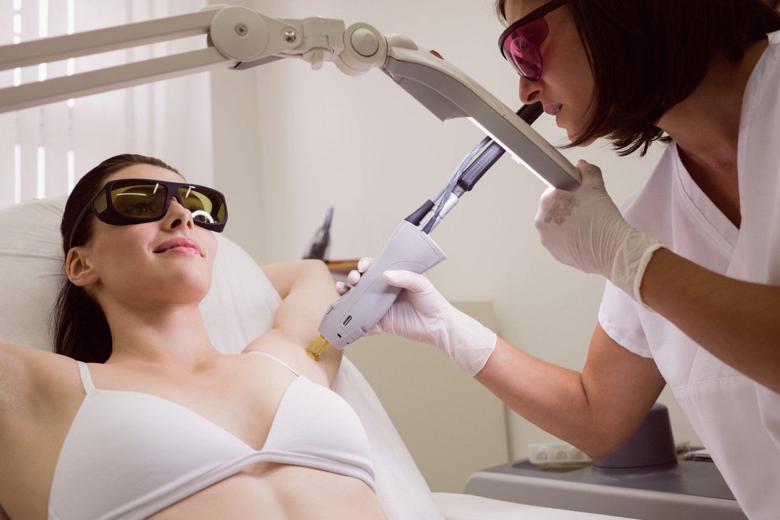 DHA-licensed clinician performing Evoline laser hair removal at Sasha Aesthetic Clinic JVC Dubai